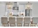 Bright kitchen features a large island with seating and stylish pendant lighting at 4026 Bonfire Dr, Odessa, FL 33556
