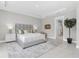 Well-lit main bedroom with decorative plants and neutral decor at 4026 Bonfire Dr, Odessa, FL 33556