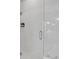 Modern bathroom features a frameless glass shower with subway tile at 4026 Bonfire Dr, Odessa, FL 33556