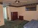 Bedroom showcases natural light, ceiling fan, closet, and vintage dresser and nightstand at 4420 Sawgrass Blvd, New Port Richey, FL 34653