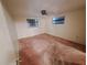 Bedroom features neutral colored walls, carpet, and two windows for natural light at 4420 Sawgrass Blvd, New Port Richey, FL 34653