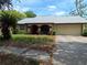 Charming single-story home featuring an attached garage and well-maintained landscaping at 4420 Sawgrass Blvd, New Port Richey, FL 34653