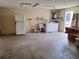 The garage features laundry appliances, including a washer, dryer, and utility sink at 4420 Sawgrass Blvd, New Port Richey, FL 34653