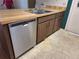 The kitchen features a stainless steel dishwasher, light wood countertop, and wood cabinets at 4420 Sawgrass Blvd, New Port Richey, FL 34653