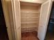 Open linen closet with shelving for storage of towels and linens at 4420 Sawgrass Blvd, New Port Richey, FL 34653