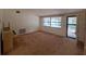 Spacious living room with a large window and neutral walls that provide a cozy ambiance at 4420 Sawgrass Blvd, New Port Richey, FL 34653