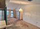 Bright living room with views of the kitchen and access to the front door at 4420 Sawgrass Blvd, New Port Richey, FL 34653