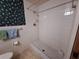 Walk-in shower with tiled walls and vintage fixtures at 4420 Sawgrass Blvd, New Port Richey, FL 34653
