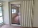 The sunroom offers extra space for relaxing with view to a living room at 4420 Sawgrass Blvd, New Port Richey, FL 34653