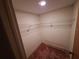 Spacious walk-in closet with wire shelving for optimal storage and carpeted floor at 4420 Sawgrass Blvd, New Port Richey, FL 34653