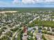 Aerial view of the property and the surrounding neighborhood at 4481 Birchfield Loop, Spring Hill, FL 34609