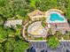 Aerial view of a community center featuring a pool, playground, splash pad and more at 4481 Birchfield Loop, Spring Hill, FL 34609