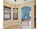 Bright breakfast nook with modern light fixture and view into the living room at 4481 Birchfield Loop, Spring Hill, FL 34609