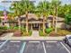 Sterling Hill South clubhouse with palm trees and accessible parking at 4481 Birchfield Loop, Spring Hill, FL 34609