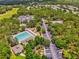 Aerial shot of the community pool, clubhouse and parking area at 4481 Birchfield Loop, Spring Hill, FL 34609
