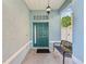 Charming front porch with bench seating and decorative lighting, creating a welcoming entrance at 4481 Birchfield Loop, Spring Hill, FL 34609