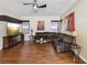 Spacious living room with hardwood floors, comfortable seating, and ample natural light at 4481 Birchfield Loop, Spring Hill, FL 34609