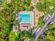 Aerial view of the community pool and playground with parking lot at 4481 Birchfield Loop, Spring Hill, FL 34609