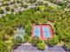 Overhead view of two tennis courts and a basketball court at 4481 Birchfield Loop, Spring Hill, FL 34609