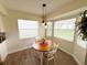 Cozy breakfast nook with natural light and modern pendant lighting at 4702 Portland Manor Dr, New Port Richey, FL 34655