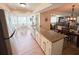 Open-concept kitchen with a breakfast bar and views to dining & living areas at 4702 Portland Manor Dr, New Port Richey, FL 34655
