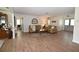 Comfortable living room with wood-look floors and an open layout, creating a warm and inviting space for relaxation at 4702 Portland Manor Dr, New Port Richey, FL 34655