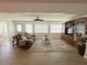 Inviting living room features wood floors and a large entertainment center at 4702 Portland Manor Dr, New Port Richey, FL 34655