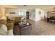 Cozy living room with wood-look floors and neutral tones, offering a relaxing atmosphere for gatherings at 4702 Portland Manor Dr, New Port Richey, FL 34655