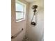 Modern shower with a shower head and pebble flooring at 4702 Portland Manor Dr, New Port Richey, FL 34655