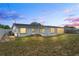The backyard of the home, with a small garden bed visible in the shot at 5321 Mosaic Dr, Holiday, FL 34690