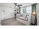 Bedroom featuring a daybed, ceiling fan, large window, sliding door closet, and dedicated desk and workspace at 5321 Mosaic Dr, Holiday, FL 34690