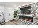 Inviting living room featuring a modern fireplace, large screen TV, and stylish decor at 5321 Mosaic Dr, Holiday, FL 34690