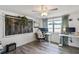 Well-lit office space featuring modern floors, a window view, and custom desk setup at 5321 Mosaic Dr, Holiday, FL 34690