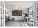 Bright home office with wood flooring, a window view, and flexible layout options at 5321 Mosaic Dr, Holiday, FL 34690