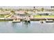 Backyard view of home with boat dock and lift at 5339 Bowline Bnd, New Port Richey, FL 34652