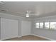Bedroom with light-colored walls, two large closets, light-colored floors, and a window at 5339 Bowline Bnd, New Port Richey, FL 34652