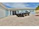 Exterior angle view of blue home with a classic black car sitting in the front of the house at 5339 Bowline Bnd, New Port Richey, FL 34652