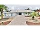 Charming single story home with beautiful landscaping, brick paver driveway and front yard palm trees at 5339 Bowline Bnd, New Port Richey, FL 34652
