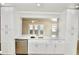 Well-appointed kitchen with white cabinets, stainless steel appliances, and a view of the waterfront enhances the home's appeal at 5339 Bowline Bnd, New Port Richey, FL 34652
