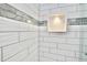 An up close shot of the shower reveals a stylish niche for soaps and shampoos at 5339 Bowline Bnd, New Port Richey, FL 34652