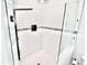 A sleek shower with white subway tile, glass enclosure, and black hardware at 5339 Bowline Bnd, New Port Richey, FL 34652