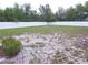 Large backyard featuring a white vinyl privacy fence and mature trees, ideal for outdoor activities and relaxation at 5373 Frost Rd, Spring Hill, FL 34606