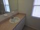 The bathroom features tiled floors and a vanity with ample storage and counter space at 5373 Frost Rd, Spring Hill, FL 34606