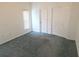 The room has neutral carpet, closet and natural light at 5373 Frost Rd, Spring Hill, FL 34606