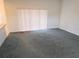 The living room features sliding door access to the outdoors, neutral carpet, and ample space at 5373 Frost Rd, Spring Hill, FL 34606
