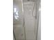 Tiled shower stall with glass door and chrome fixtures, ready for a refreshing experience at 5373 Frost Rd, Spring Hill, FL 34606