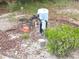 Well water system installed with pump, water tank, and full filtration system for water quality and irrigation at 5373 Frost Rd, Spring Hill, FL 34606