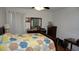 Bright bedroom with patterned quilt, wood furniture, and plenty of natural light at 5434 Chad Pl # 14, New Port Richey, FL 34652