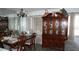 A dining room with mirror wall and lovely hutch at 5434 Chad Pl # 14, New Port Richey, FL 34652