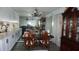 Traditional dining room featuring elegant furnishings, modern lighting, and abundant natural light at 5434 Chad Pl # 14, New Port Richey, FL 34652